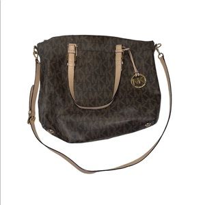 Michael Kors Purse. Great condition. Brown monogram. Can fit laptop or iPad.